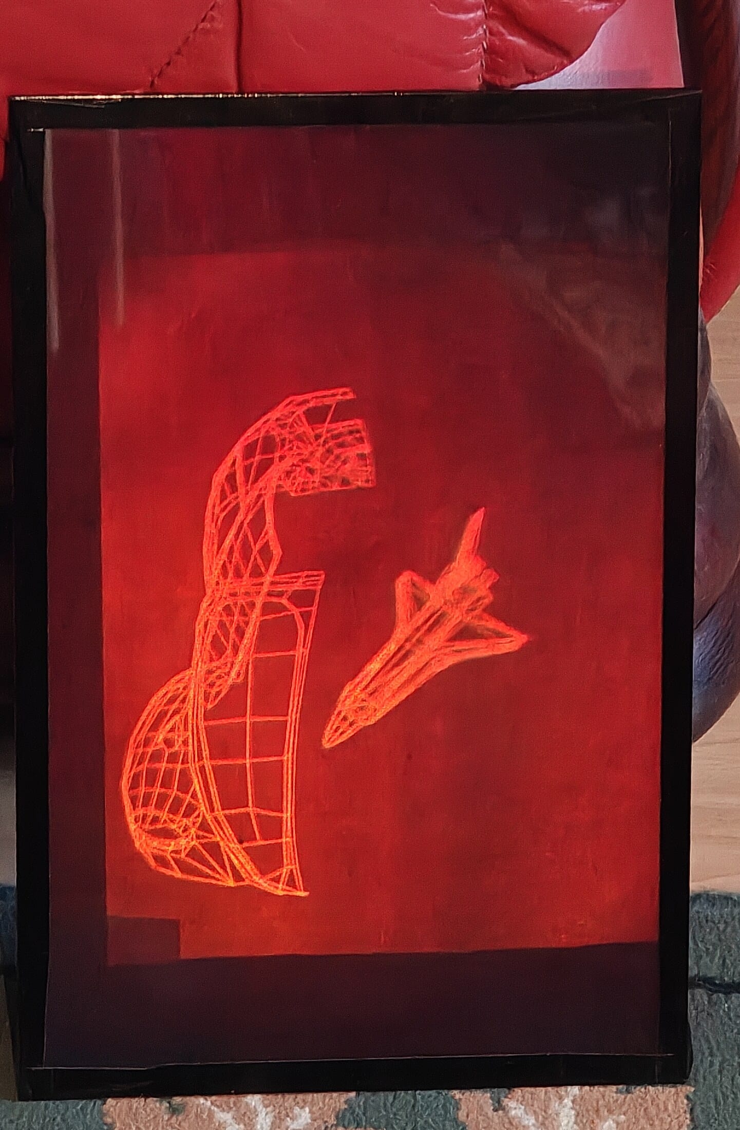 The 1987–1988 multiplexed hologram showing wireframe Beetle and Space Shuttle models.